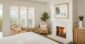 Bed and sitting area in fireplace room